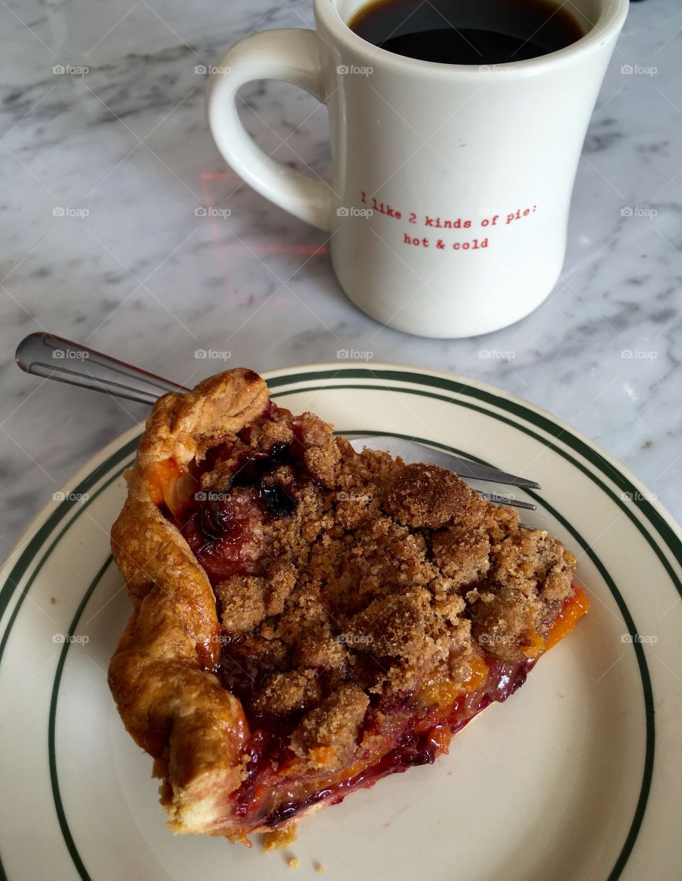 A slice of american pie with a cup of coffee.
