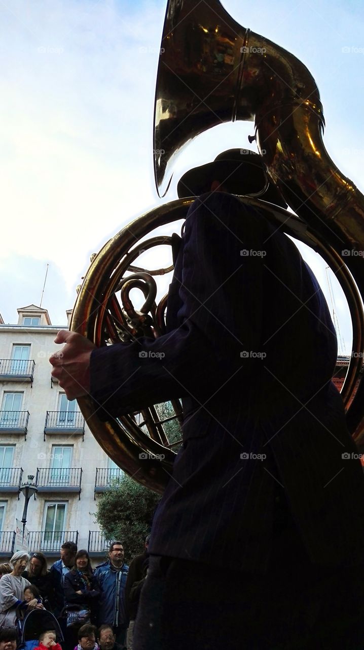 trumpeter playing the french horn
