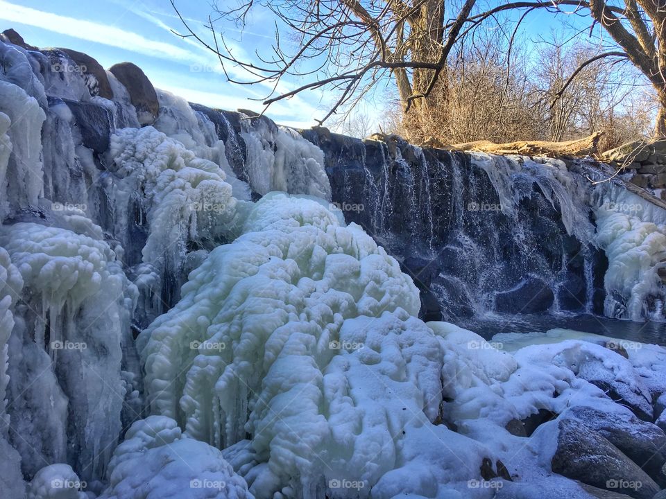Scenic view of frozen waterfall