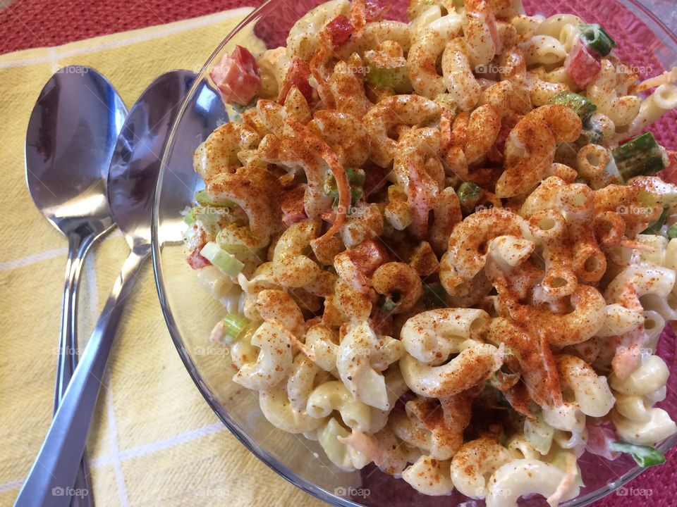 Elevated view of pasta in glass bowl