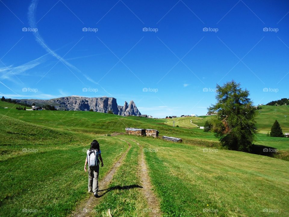 Big open field. A big,green,open field near of the mountain is a fantastic place that I saw in my vacation,Dolomites,Italy