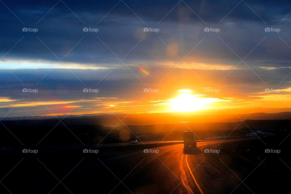 Sunset Home. All roads lead home capturing the sun setting on the road ahead.