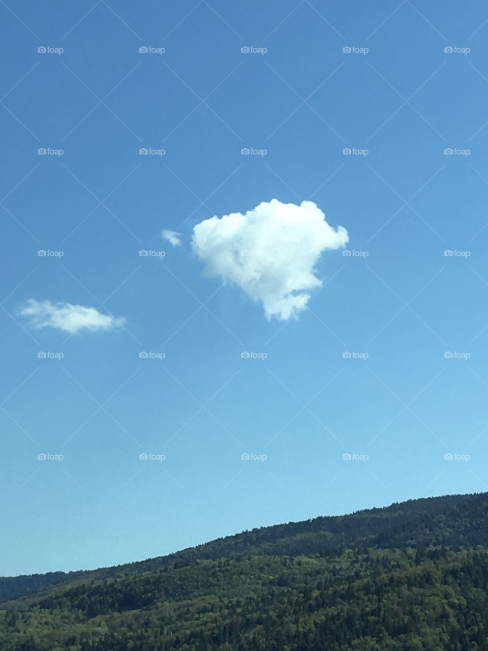 Little white clouds on hills
