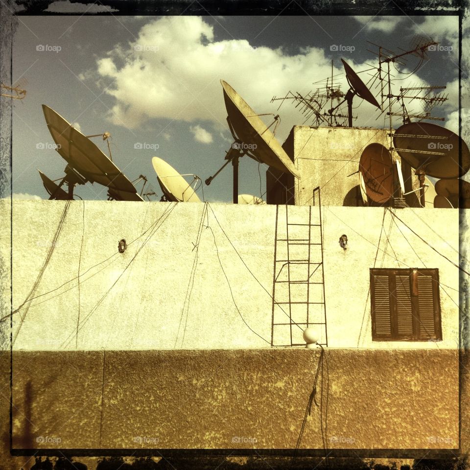 Old Rooftop. This is a common sight in many parts of Egypt - apartment building roofs' are a forest of satellite dishes!