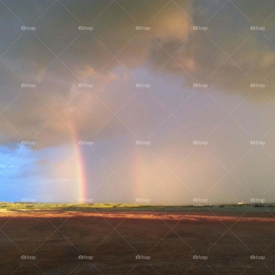 rainbow during a oncoming storm