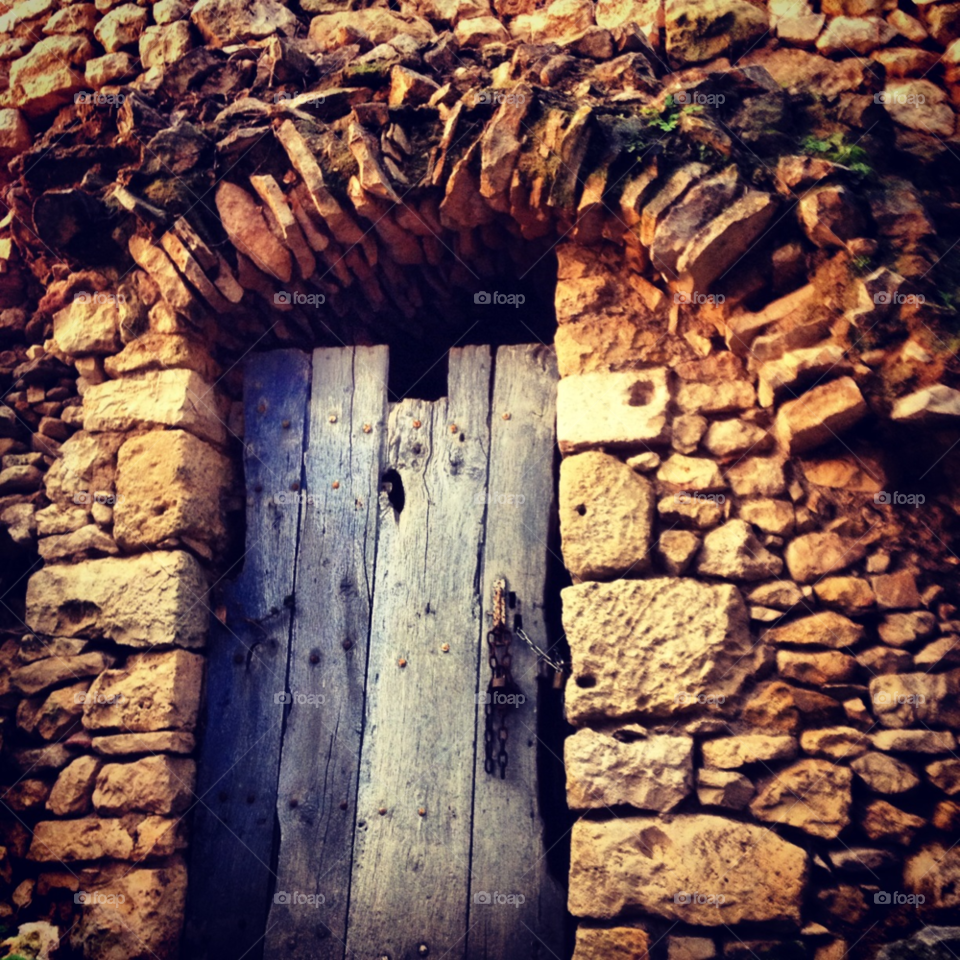 wood stone old door poitou. france by alicedebarrau