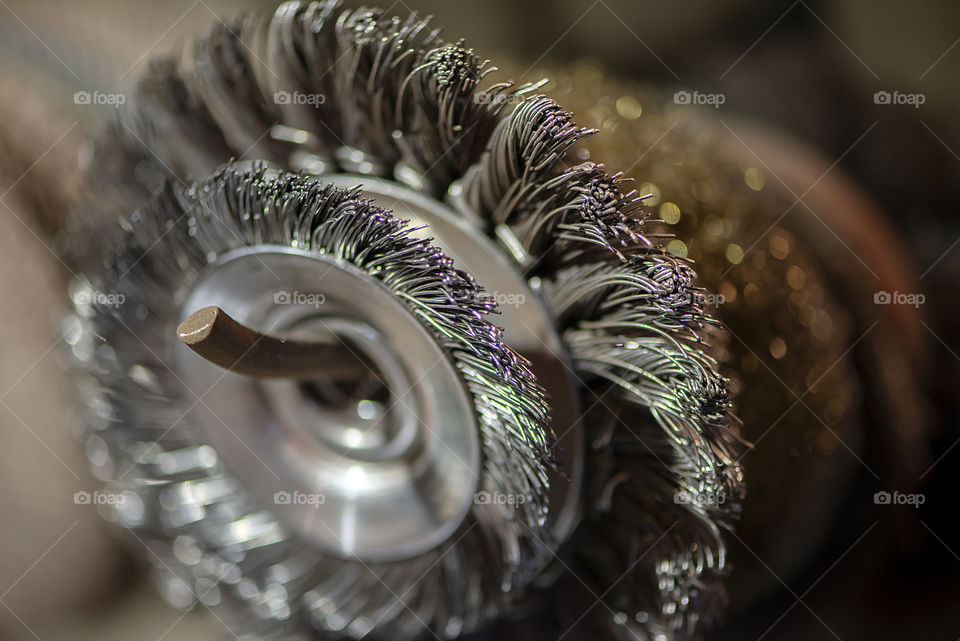 Close-up of blacksmith work tool metal wire brush