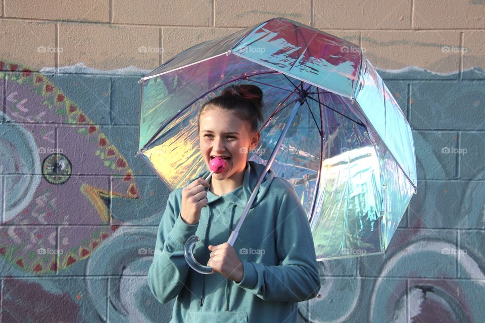 Girl holding Iridescent umbrella