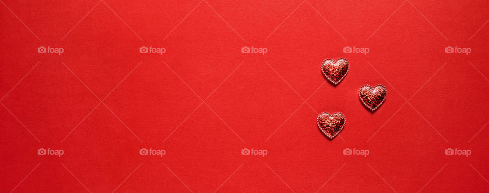 Postcard. Red hearts on a red background. Valentine's Day.