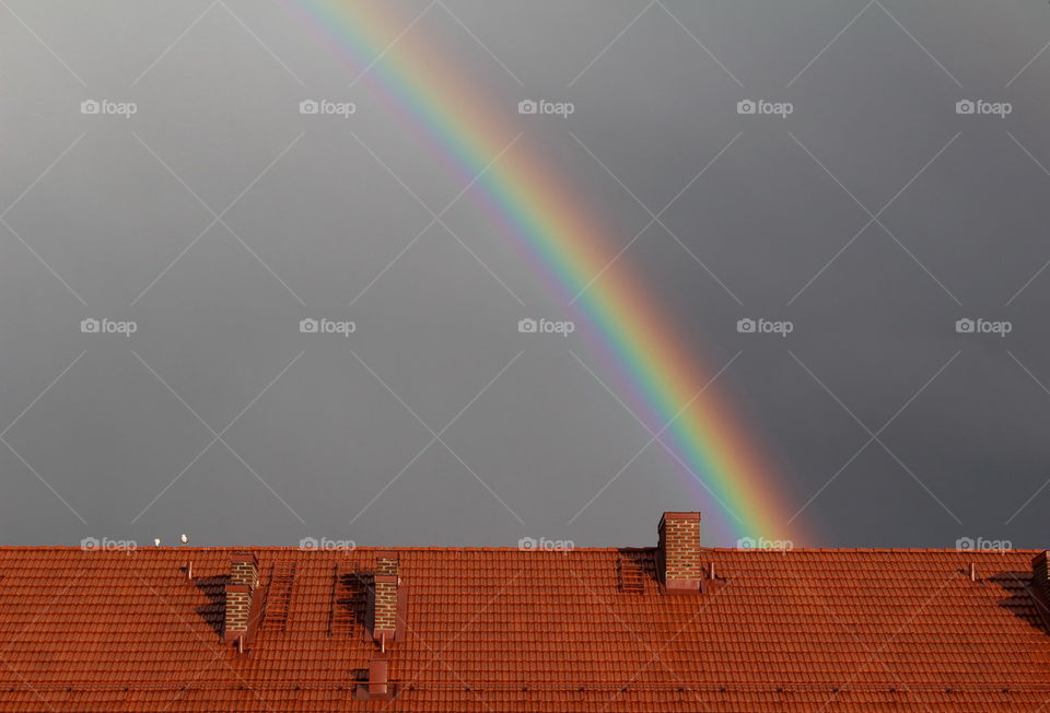 Rainbow by the rooftop.