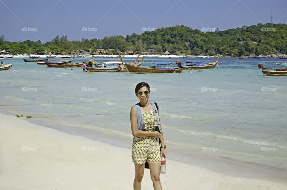 Portrait woman are Stroll the beach , Koh Lipe at Satun in Thailand.