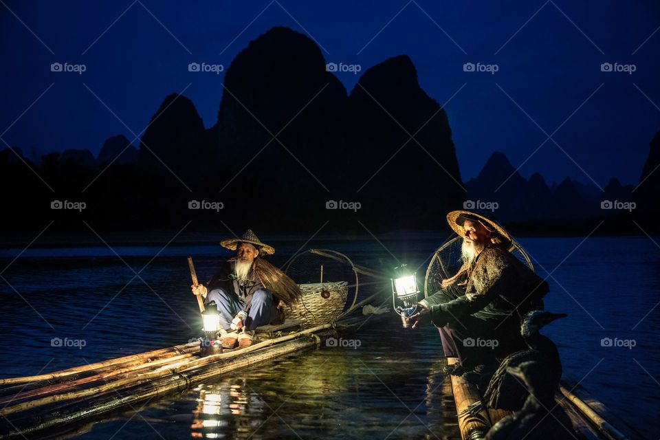Fisherman fishing at night