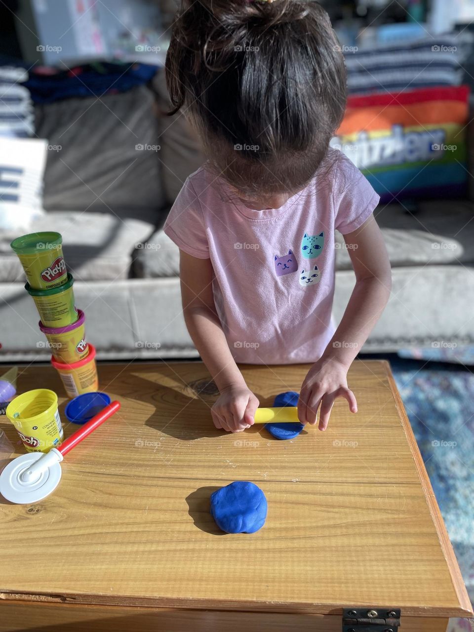 Toddler playing with playdoh, making a playdoh pizza, toddler plays pretend pizza shop