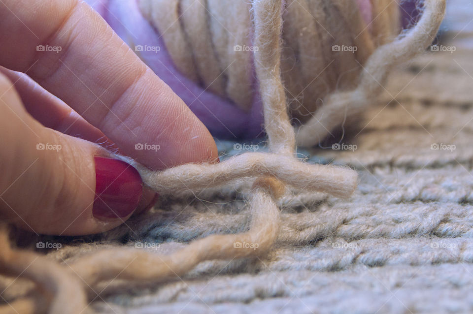 Women's hand holding woollen