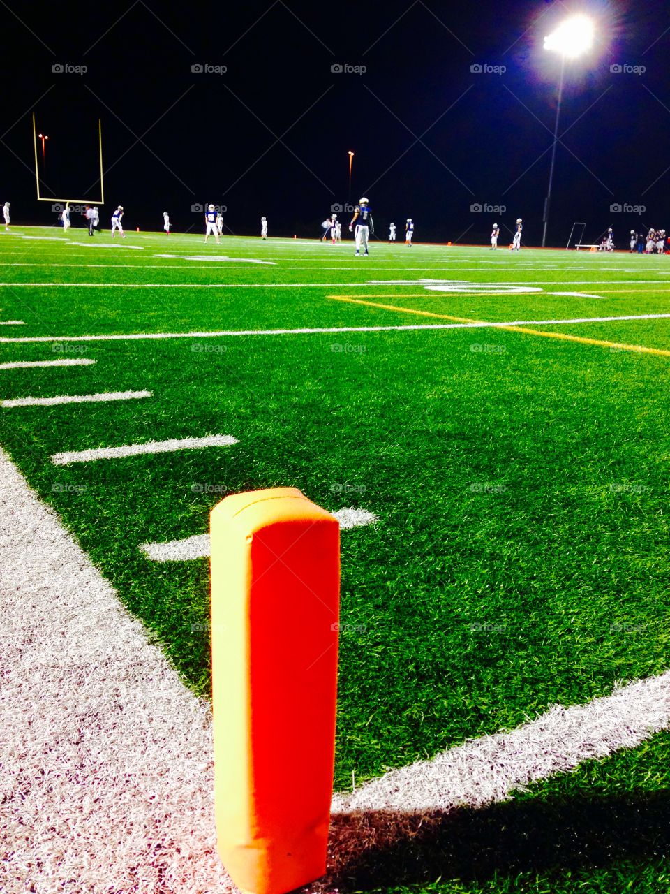 Football Field Player View. Endzone perspective of a high school football game 