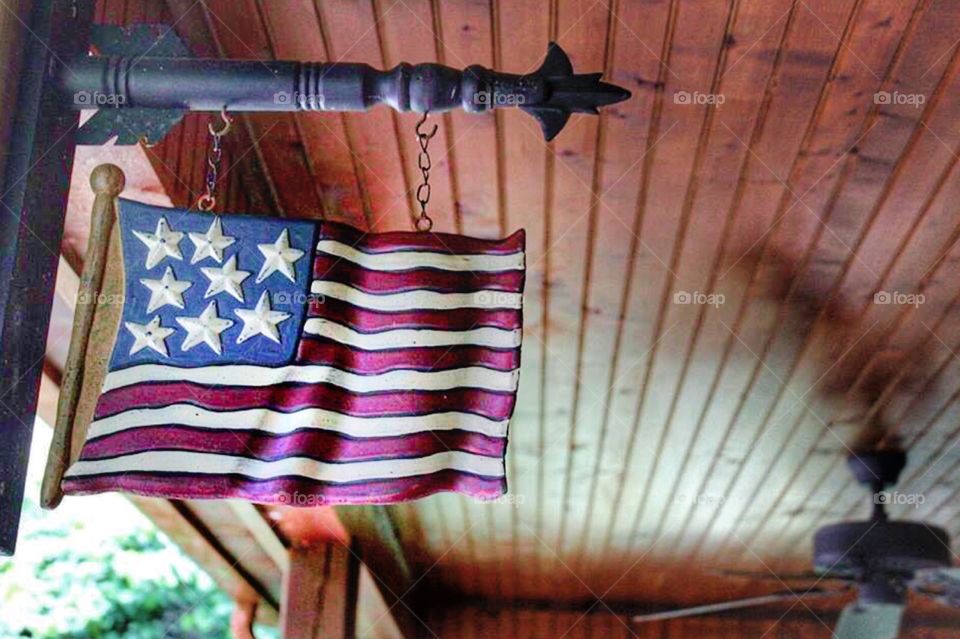 American flag on a wooden porch