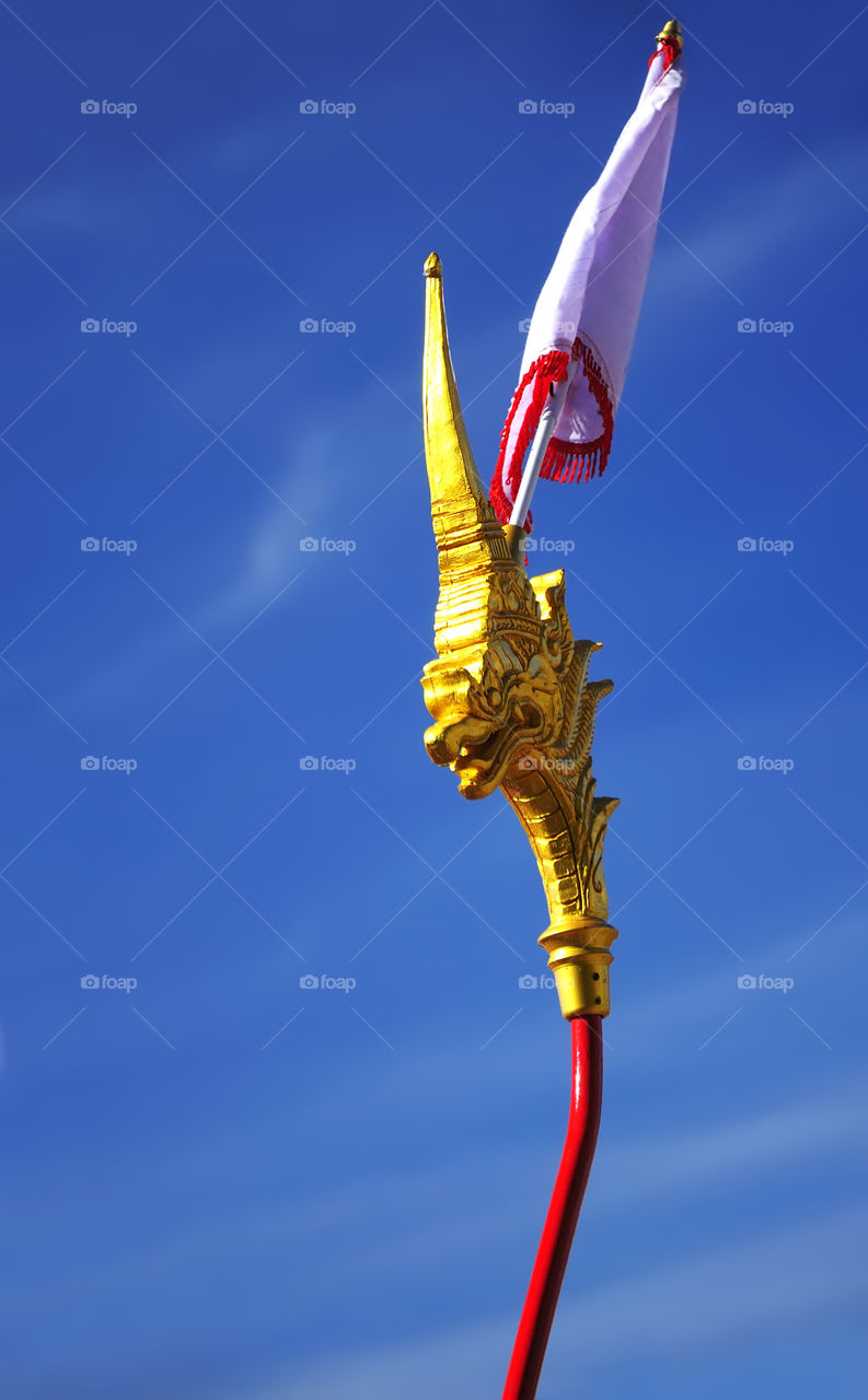 Flagstaff decorated with  golden swan head. Burmese art, Buddhist symbols.