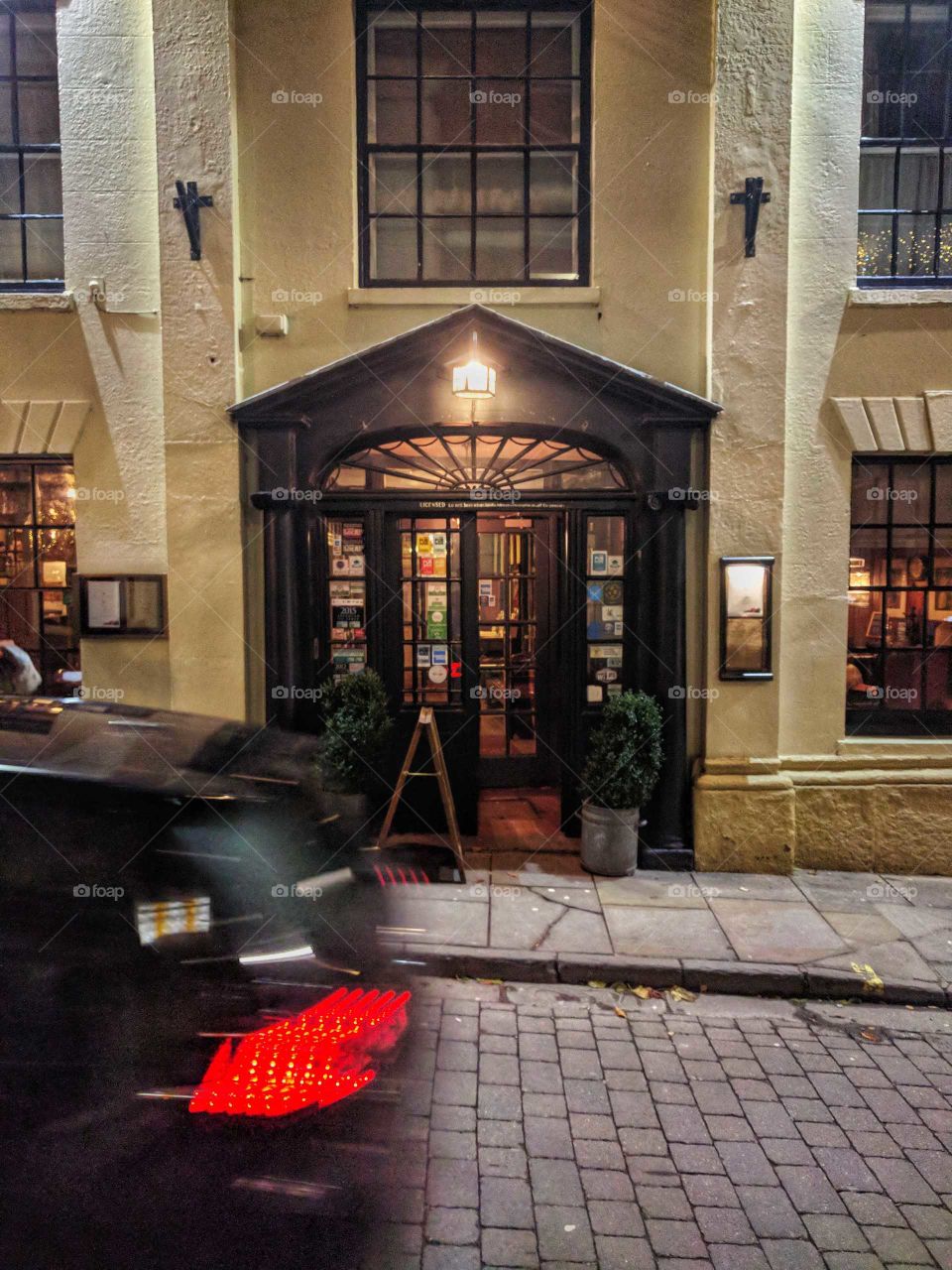 The busy nature of the tourist season in this small town is really emphasised by the blur of the passing car and the lively-looking hotel with its beautifully inviting front doors.