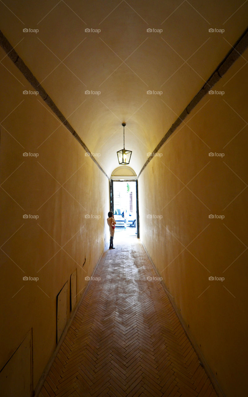 Old corridor with woman