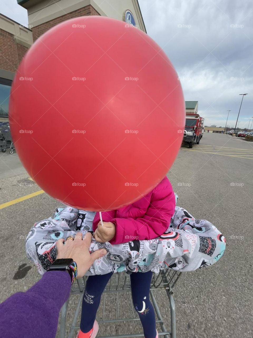 Toddler girl with big red balloon, toddler with balloon, balloon face, going to the grocery store, everyday tasks, daily activities 