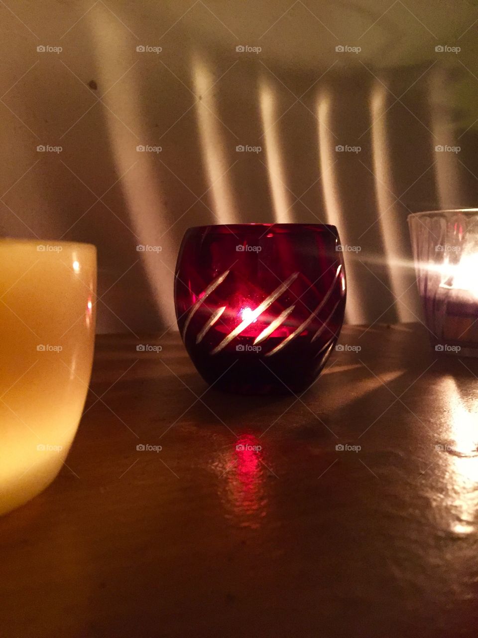 Look at how a single candle can both defy and define the darkness.