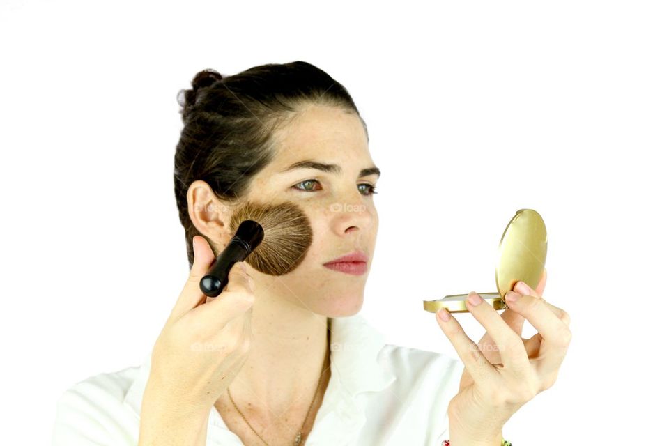 Girl applying makeup