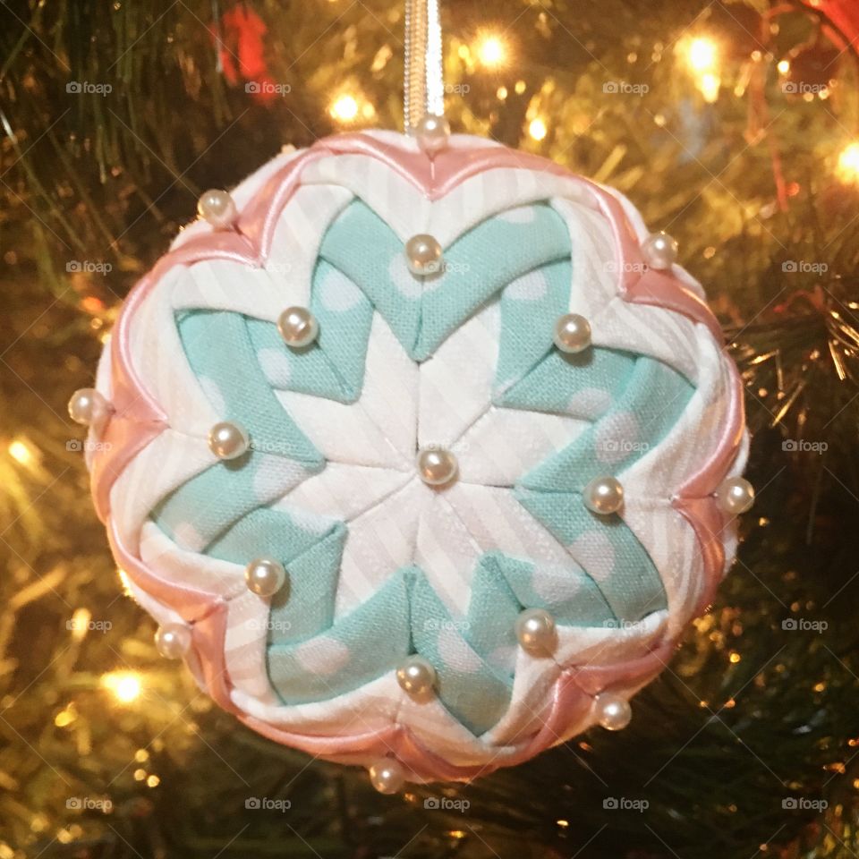 Handmade quilted Christmas ornament to celebrate the birth of a baby girl.