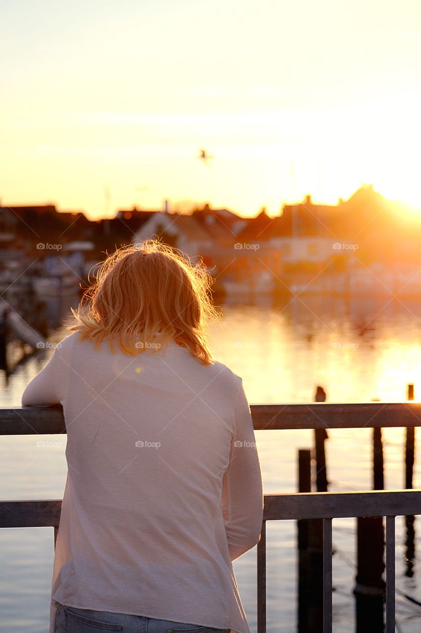 Girl looking at the sunset