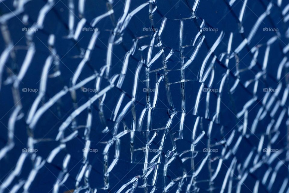 Blue cracked window glass damage situation be careful abstract background