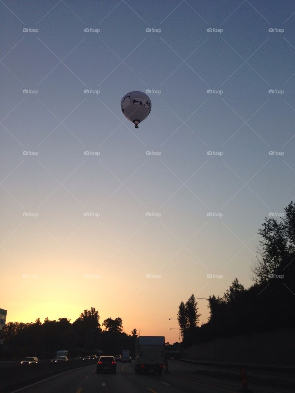 Balloon flying over road