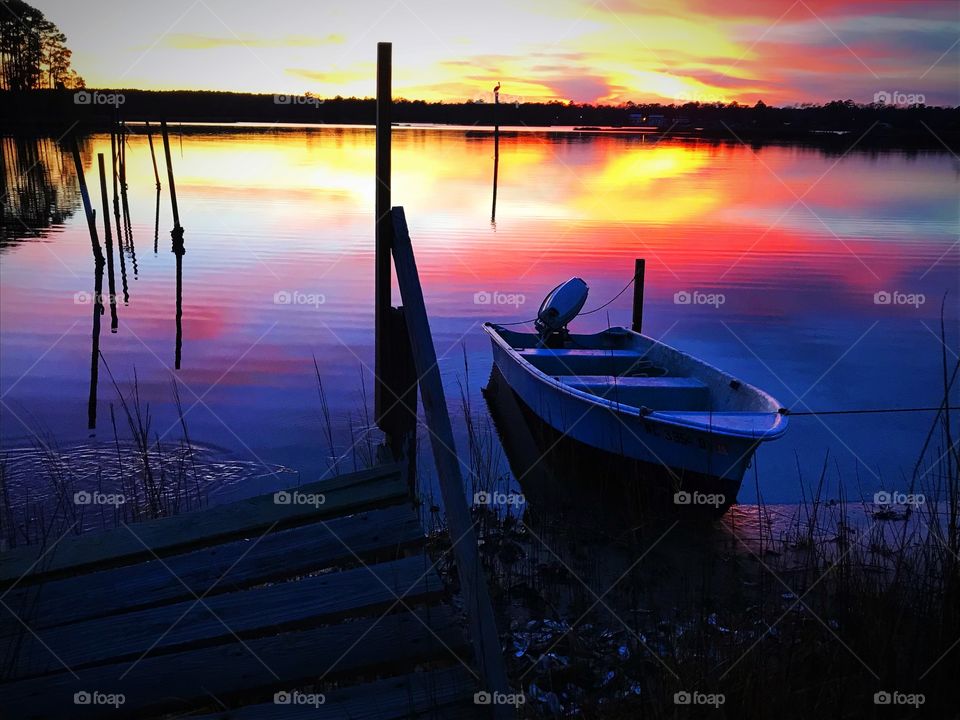 Old dock, boat, sunset