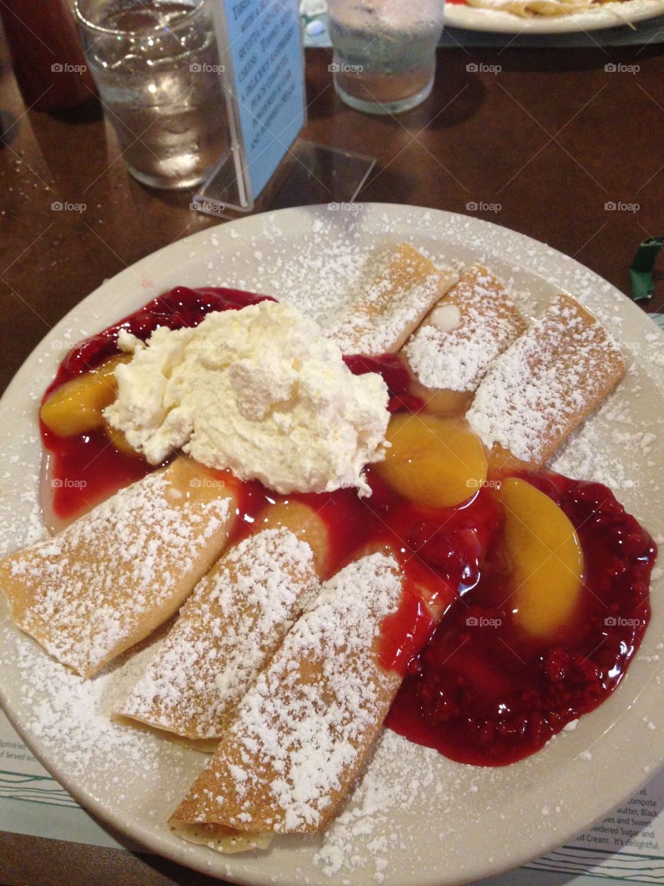 Strawberry crapes with powdered sugar for breakfast