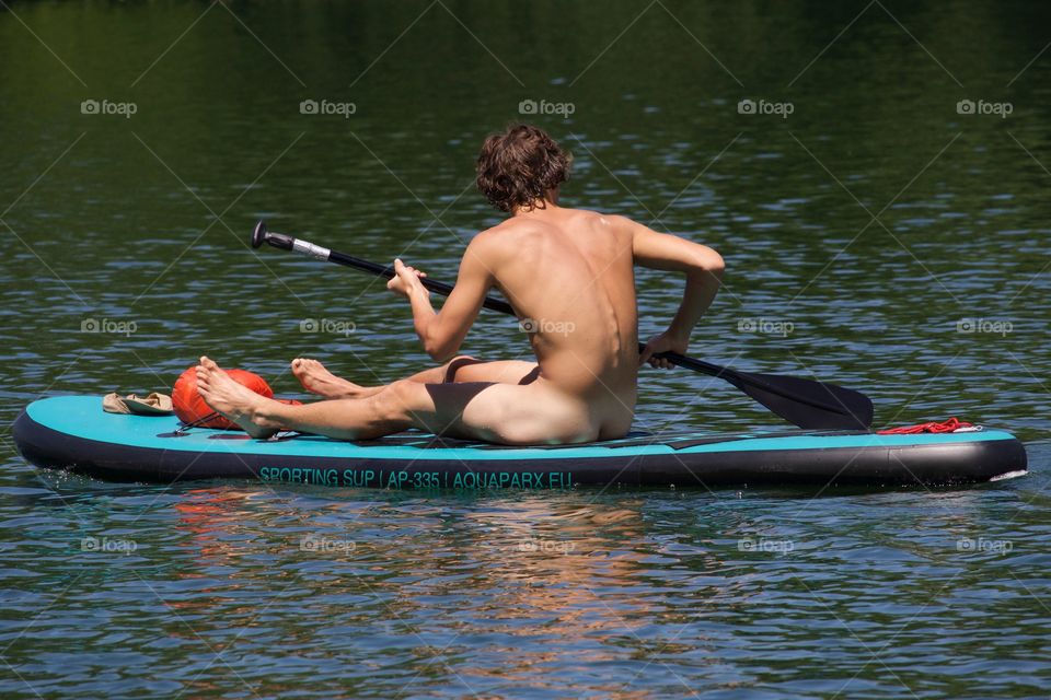 Naked Paddleboarding In Switzerland