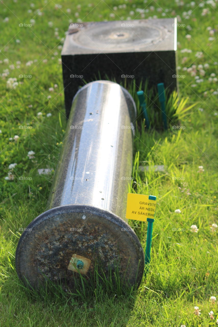 overturned gravestone