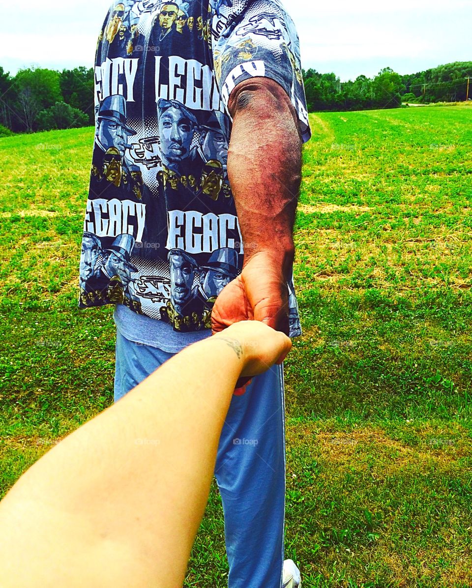 Husband leading the way. My husband taking me through the meadow.