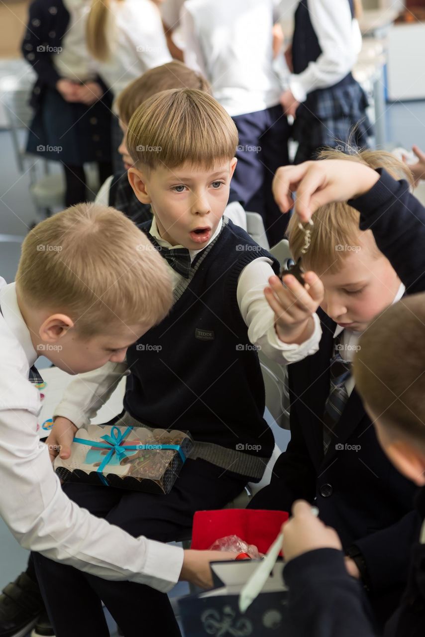 Children schoolchildren on a holiday, bright emotions surprise