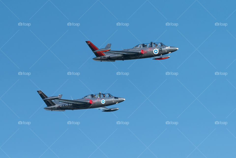 Helsinki, Finland - 9 June 2017: Two Silver Jets Aerobatic Team Fouga CM 170 Magister jets flying at the Kaivopuisto Air Show in Helsinki, Finland.