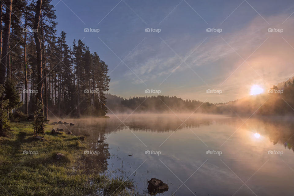 Scenic view of lake at sunrise