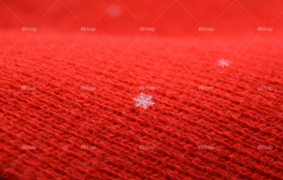 Close-up of red wool with snowflake