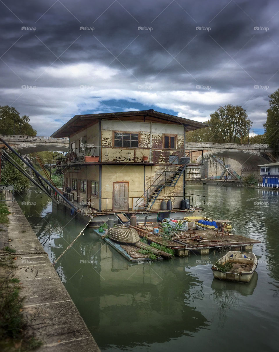 A houseboat on the Tiber River in Rome, Italy