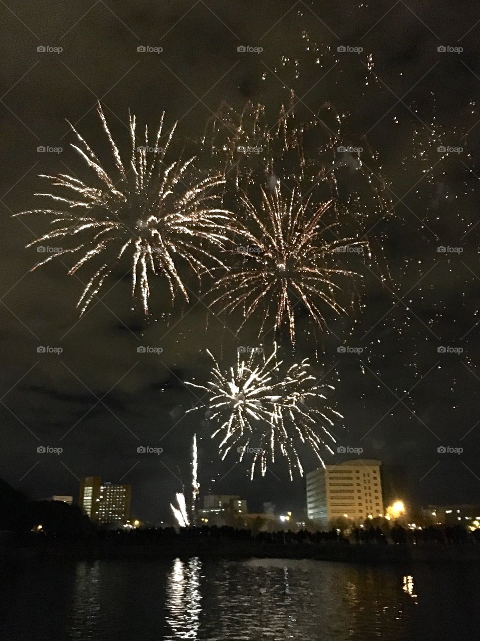 A rain of colorful firework lights to celebrate the Chinese New Year each display more brilliant and bigger than the last. 