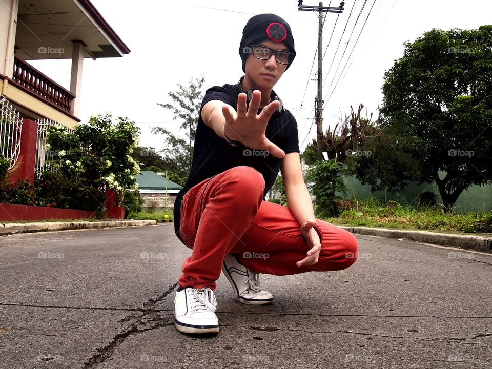 teenage boy wearing bonnet  and eyeglasses