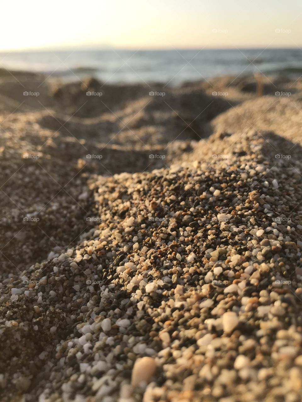 View of coarse beach sand Crete Greece 