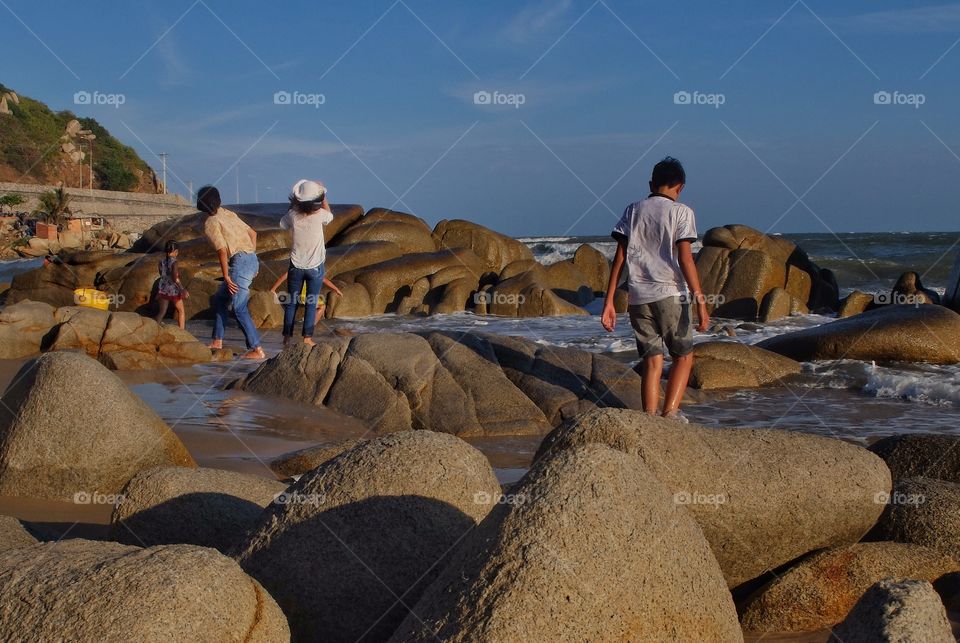 Among the rocks.