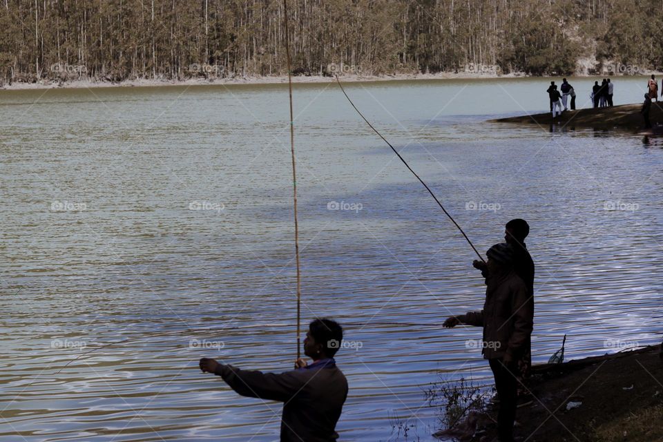 People catch fish from the river in the morning