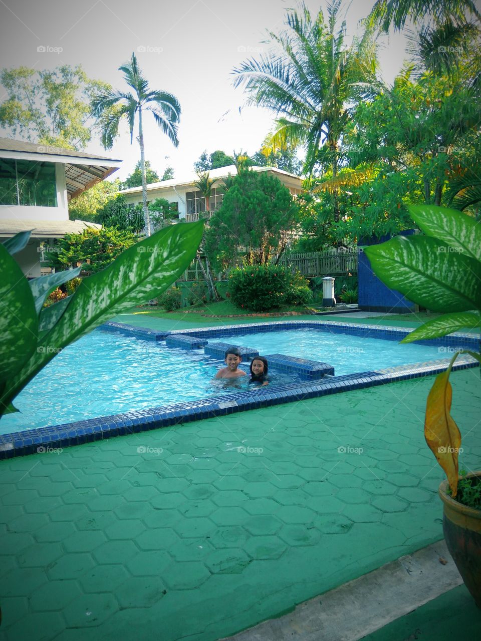 swimming pool in the green area and kids like to play there