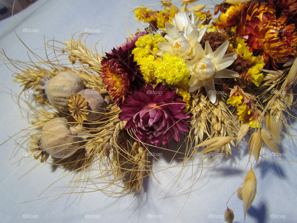 a bouquet of dried flowers and poppies on holiday