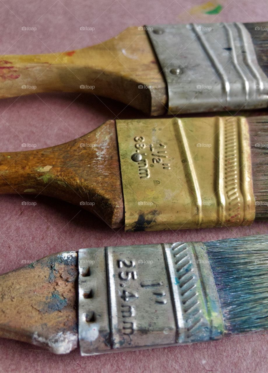 Closeup full frame view of used paintbrushes 
