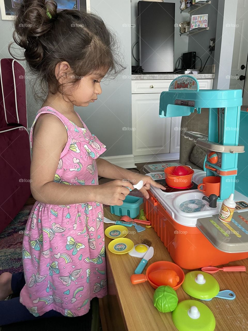 Toddler plays with toy kitchen, toddler makes mommy food, little girl plays with toy kitchen, making food for mommy, toddler plays pretend 