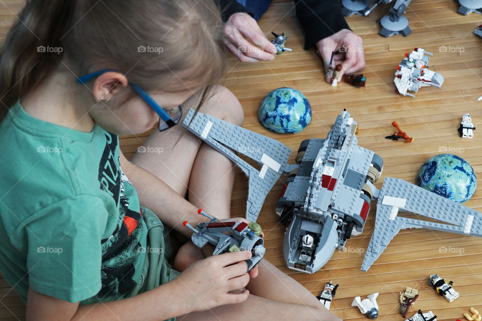 Child playing Lego Star Wars